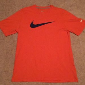 Orange Nike shirt large